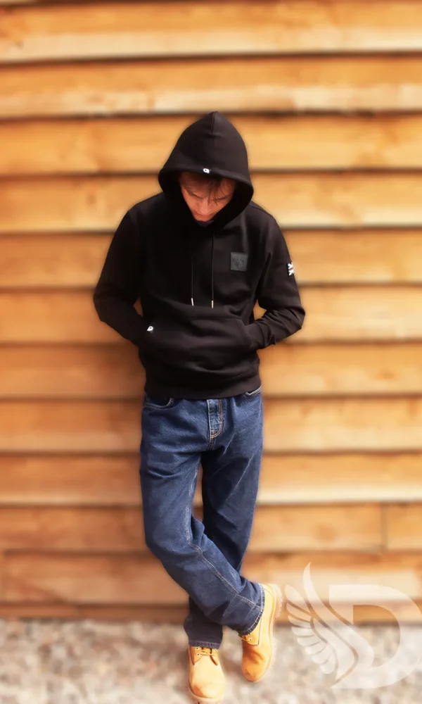 Young Man wearing DROW Wear AJ Stealth Hoodie with British military-inspired design.