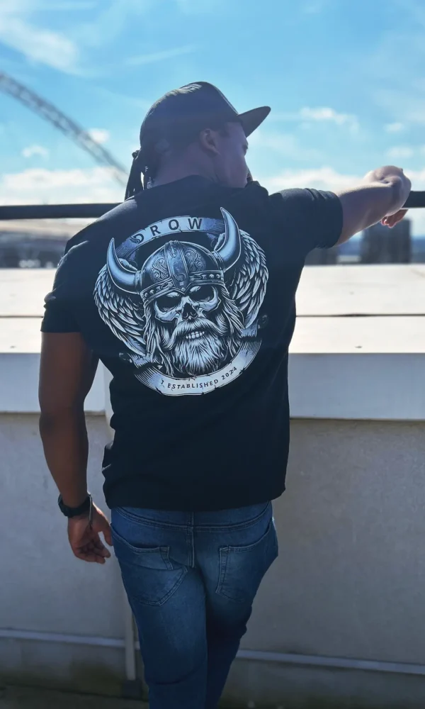 Man wearing the DROW Warrior T-Shirts with a bold statement of resilience and strength.