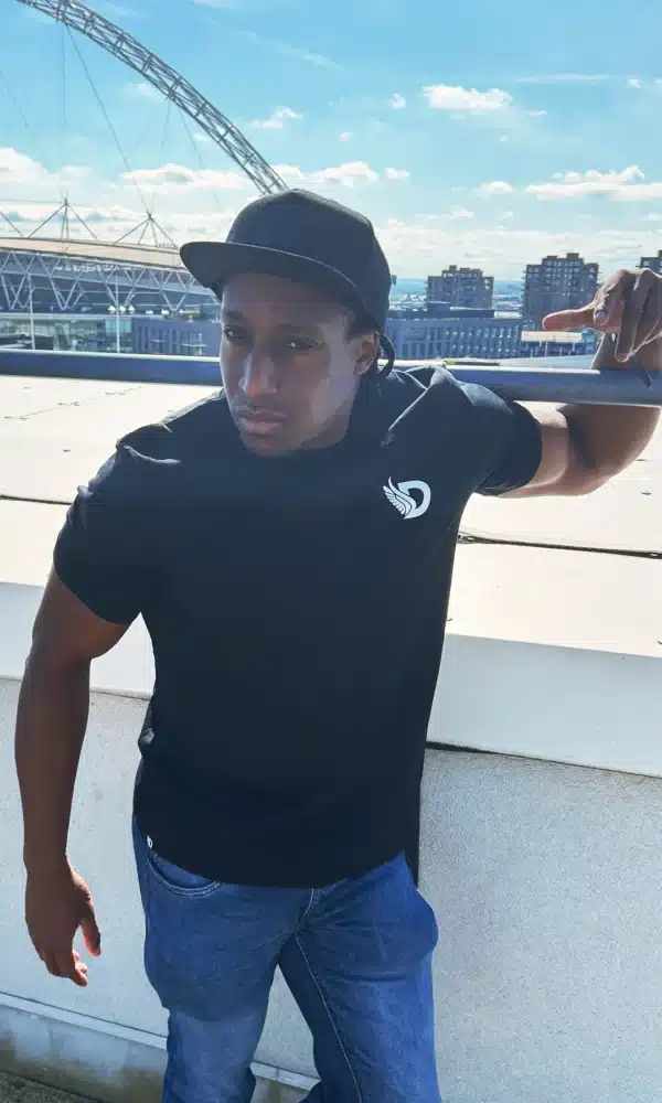 Man wearing the DROW Warrior T-Shirts with a bold statement of resilience and strength.