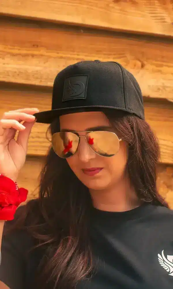 Woman wearing the DROW Black Snapback hat with Rubber D patch