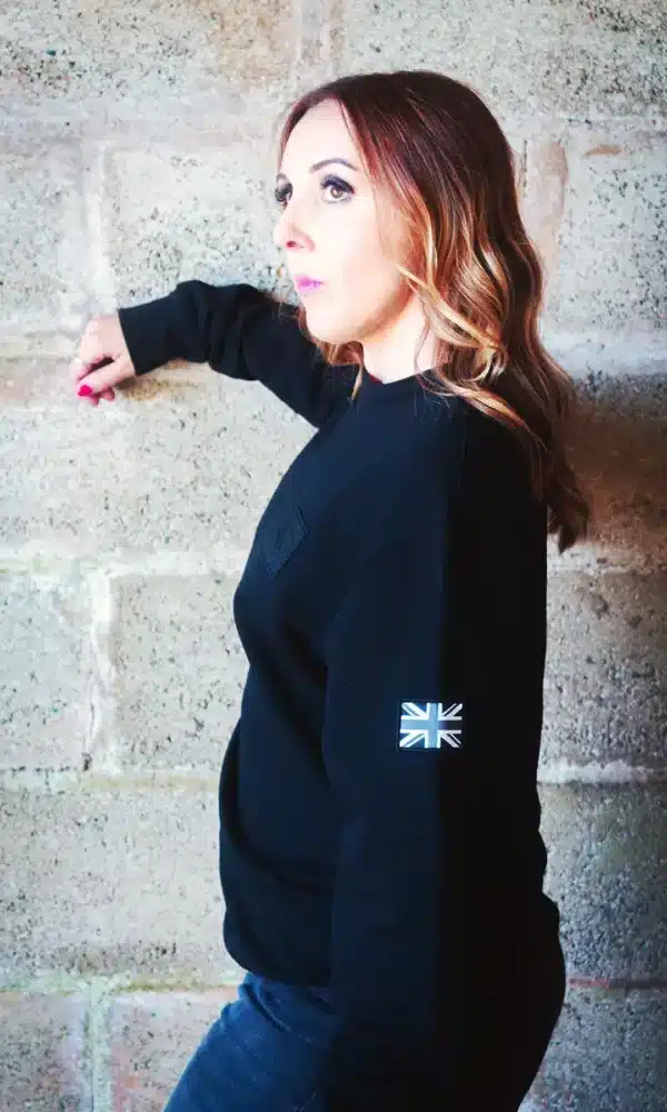 Woman Standing side on wearing the DROW AJ Stealth Sweatshirt