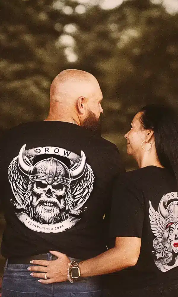 Couple wearing the DROW Rebel Valkyrie and the DROW Warrior T-Shirts with a bold statement of resilience and strength, fierce independence and rebellious attitude