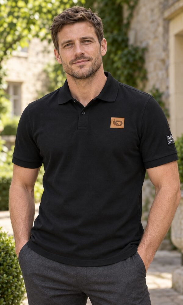 Man wearing the black DROW Heritage Polo, front outdoor view