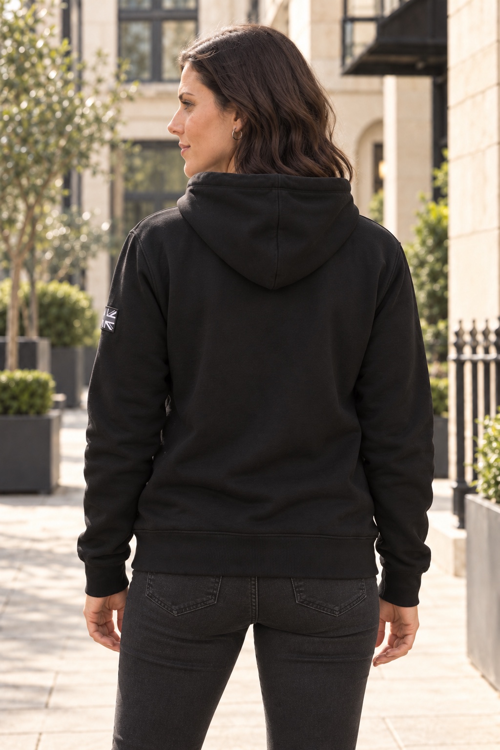 Woman wearing black DROW AJ Stealth Hoodie, rear view
