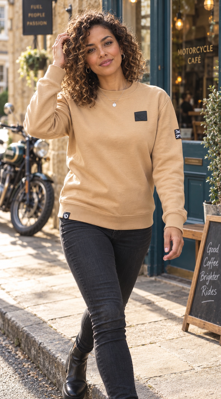 Woman wearing the tan DROW Desert Stealth Sweatshirt, front view