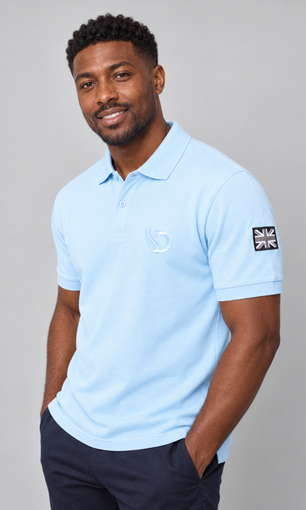 Young Black male model wearing the DROW Blue Heritage Polo, front studio view