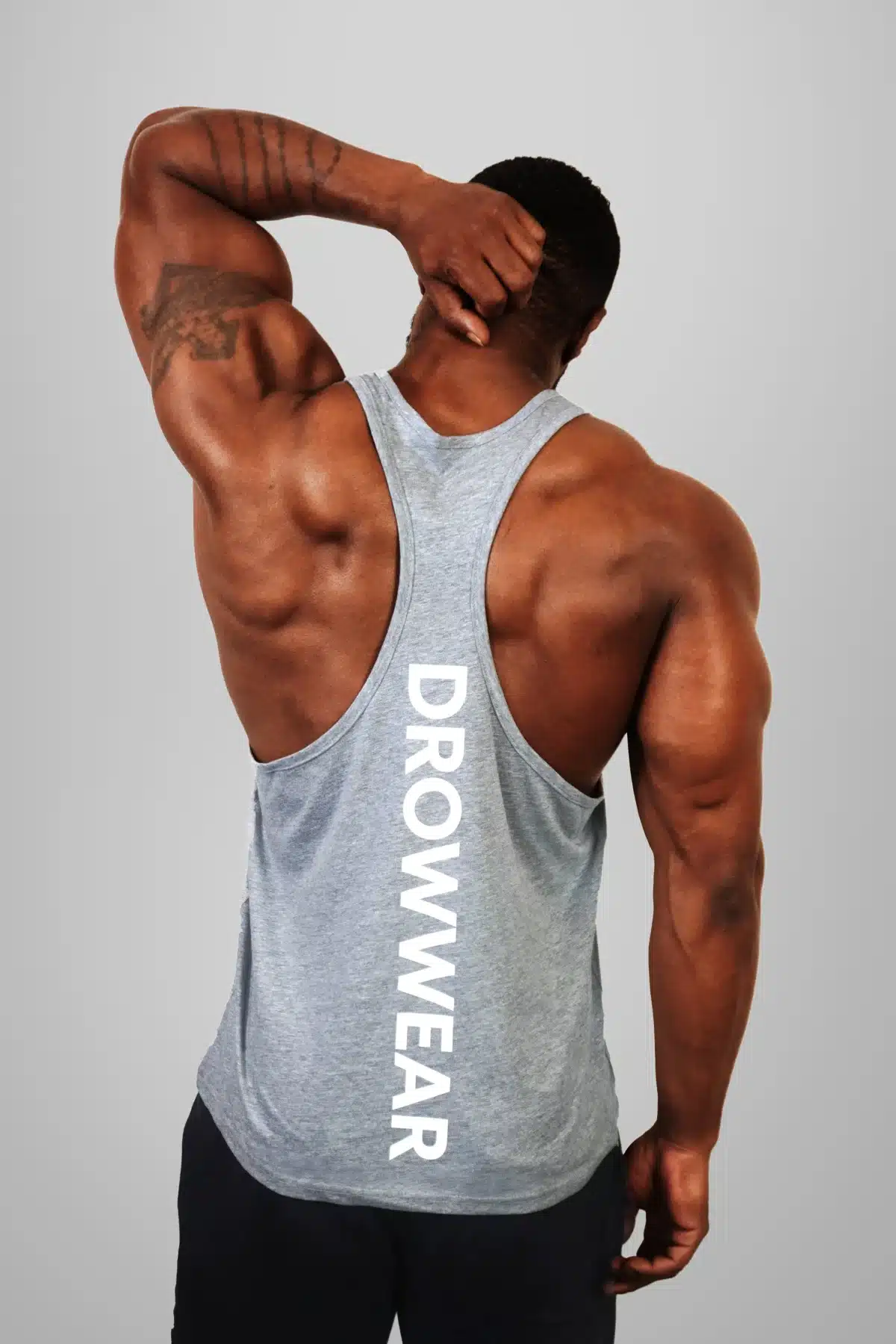 Back View of the DROW Outrider Grey Vest on a model with muscles