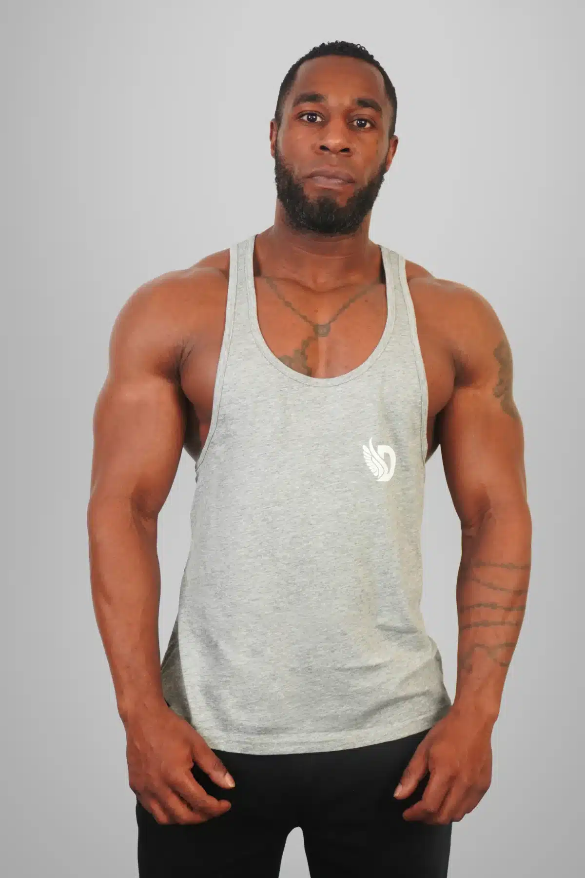 Front View of the DROW Outrider Grey Vest on a model with muscles