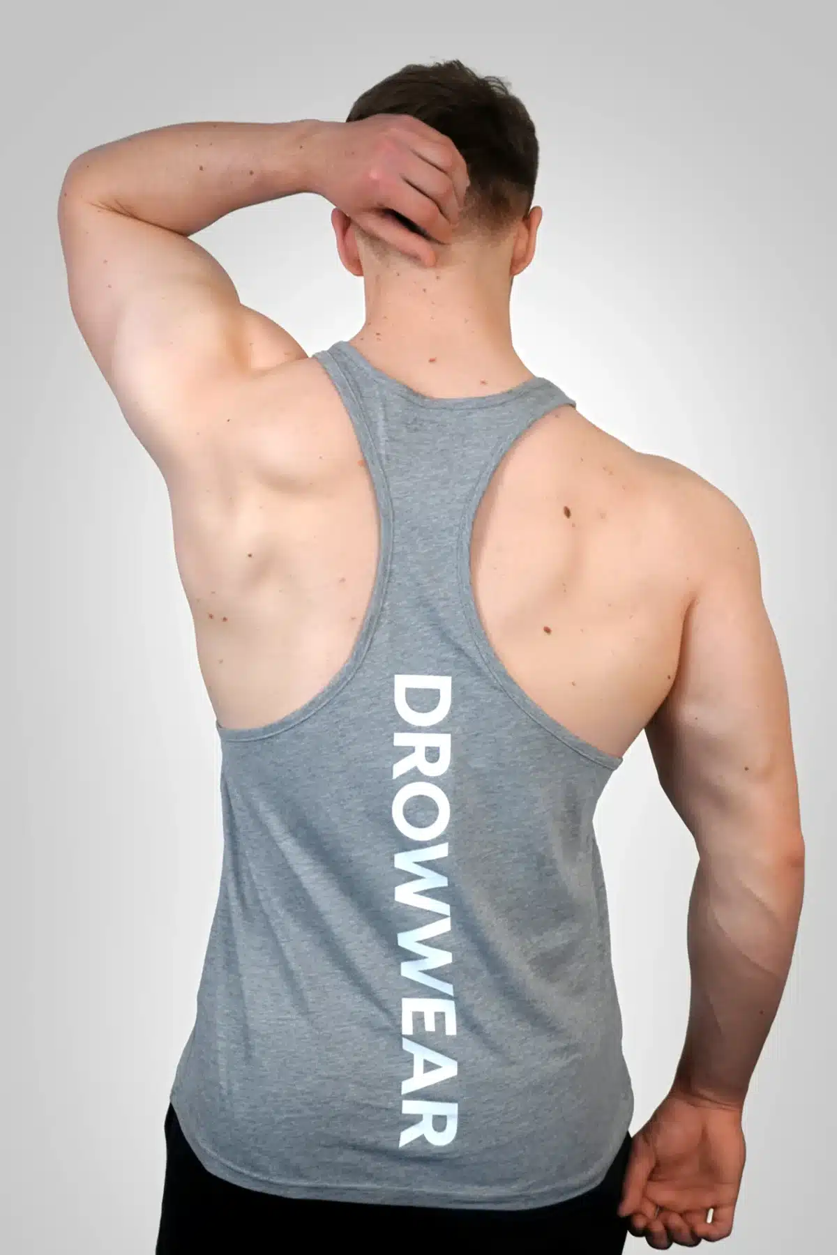 Back View of the DROW Outrider Grey Vest on a model with muscles