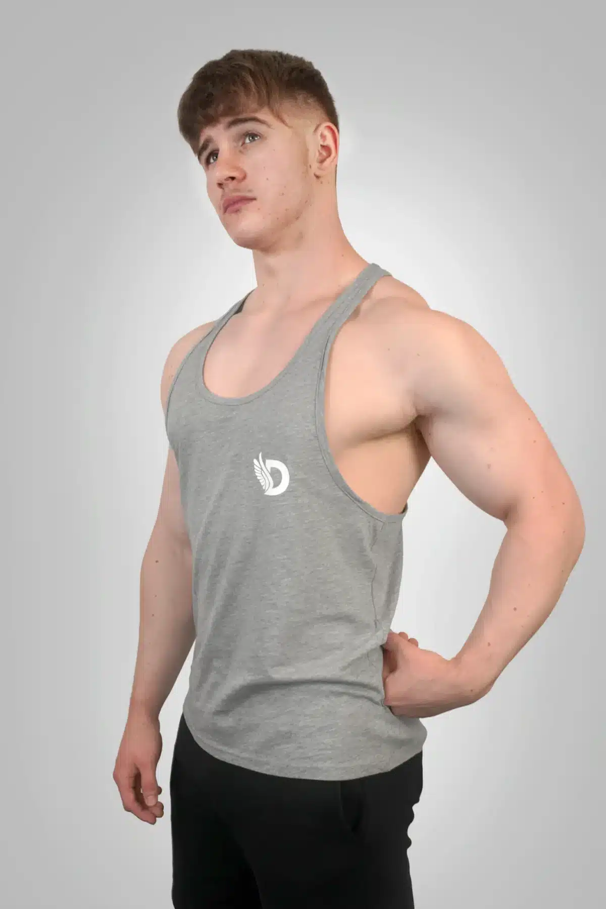 Front View of the DROW Outrider Grey Vest on a model with muscles