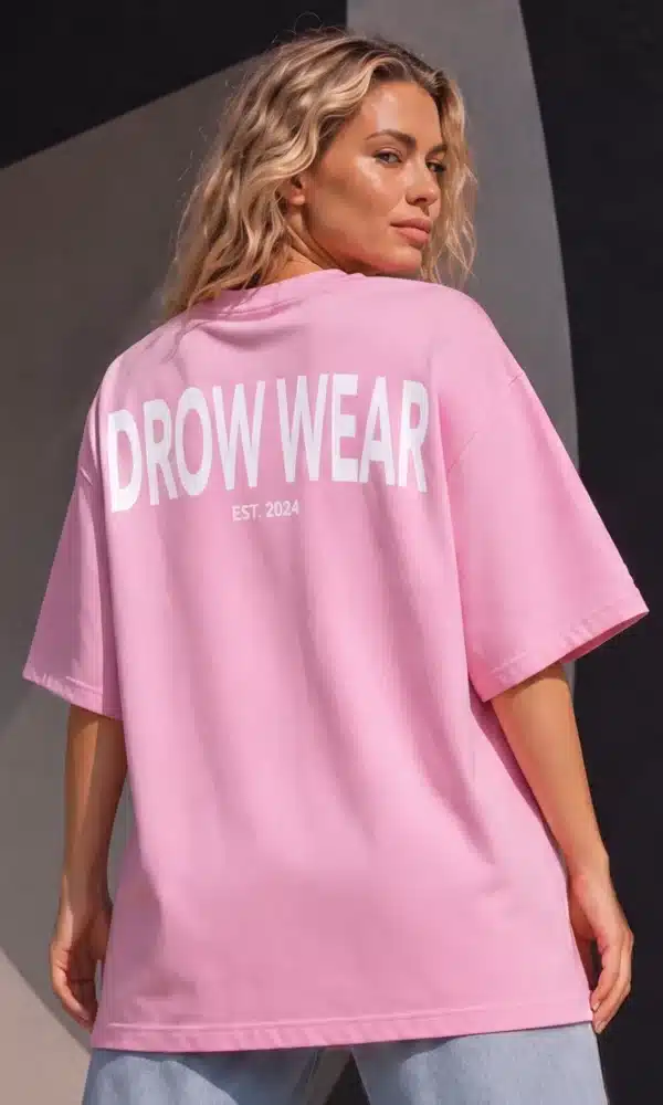 Full-length back view of woman wearing the Fearless Pink oversized boyfriend tee