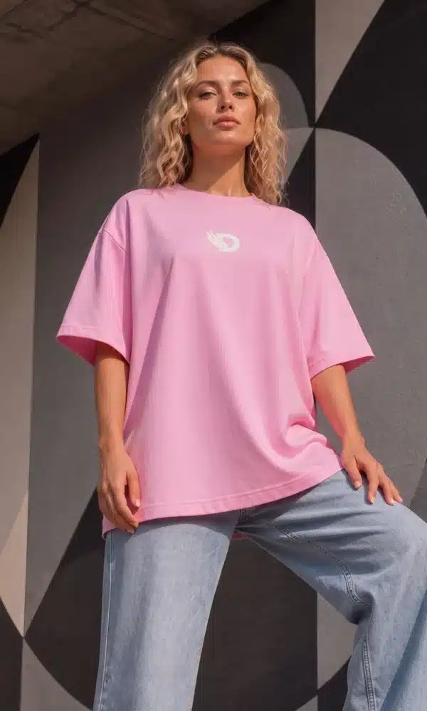 Full-length front view of woman wearing the Fearless Pink oversized boyfriend tee