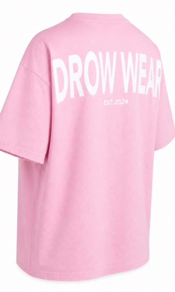 Back left view of the soft pink oversized boyfriend tee and DROW WEAR graphic