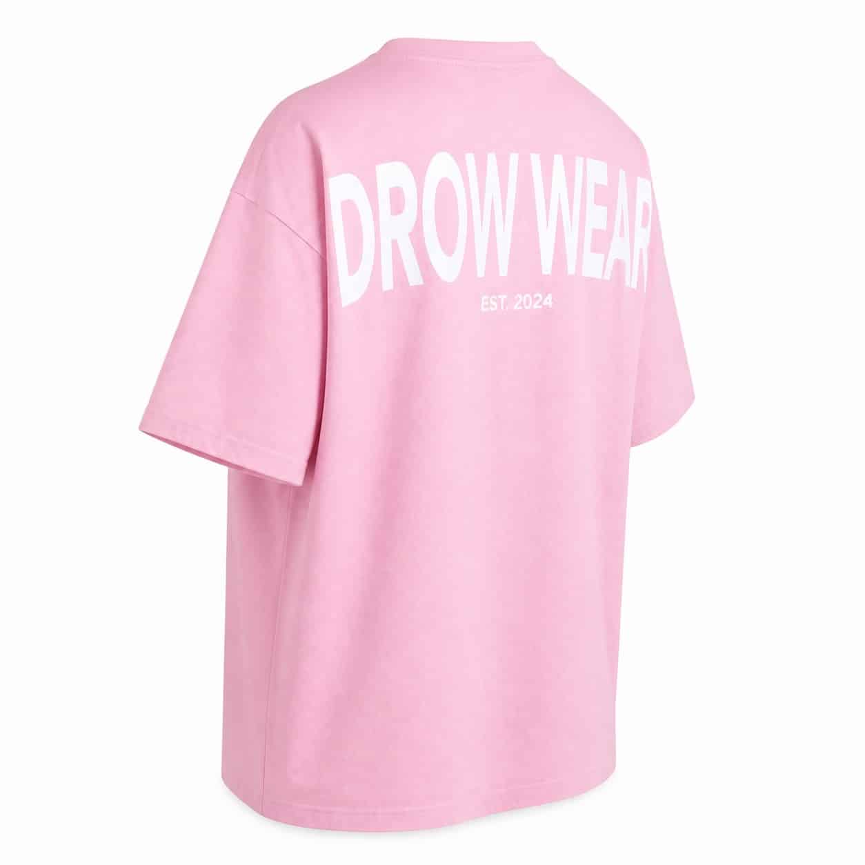 Back left view of the soft pink oversized boyfriend tee and DROW WEAR graphic