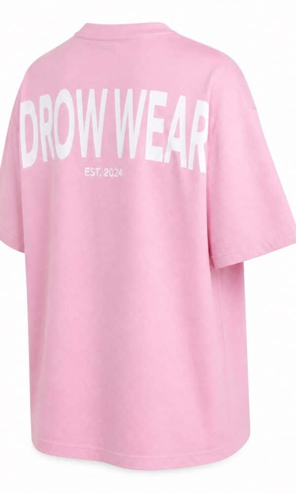 Back right view of the soft pink oversized boyfriend tee and DROW WEAR graphic